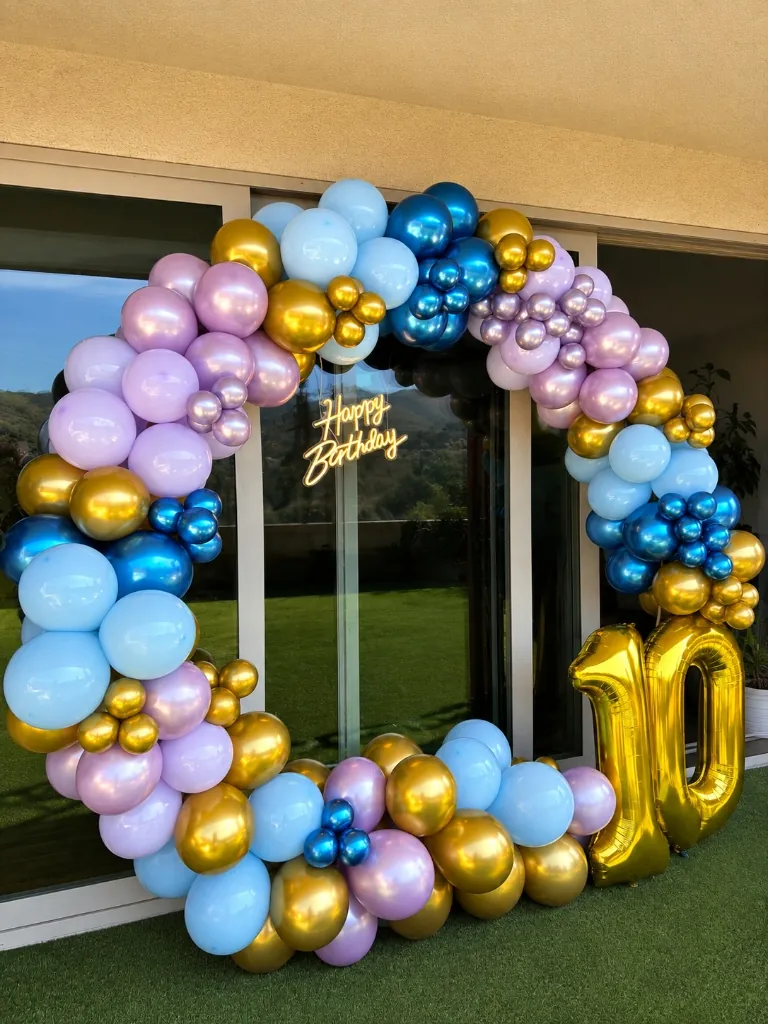 10th birthday balloon hoop with blue, purple and gold balloons